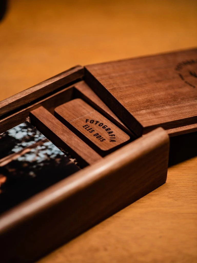 A wooden bath tray with linens, tea, and an open journal.