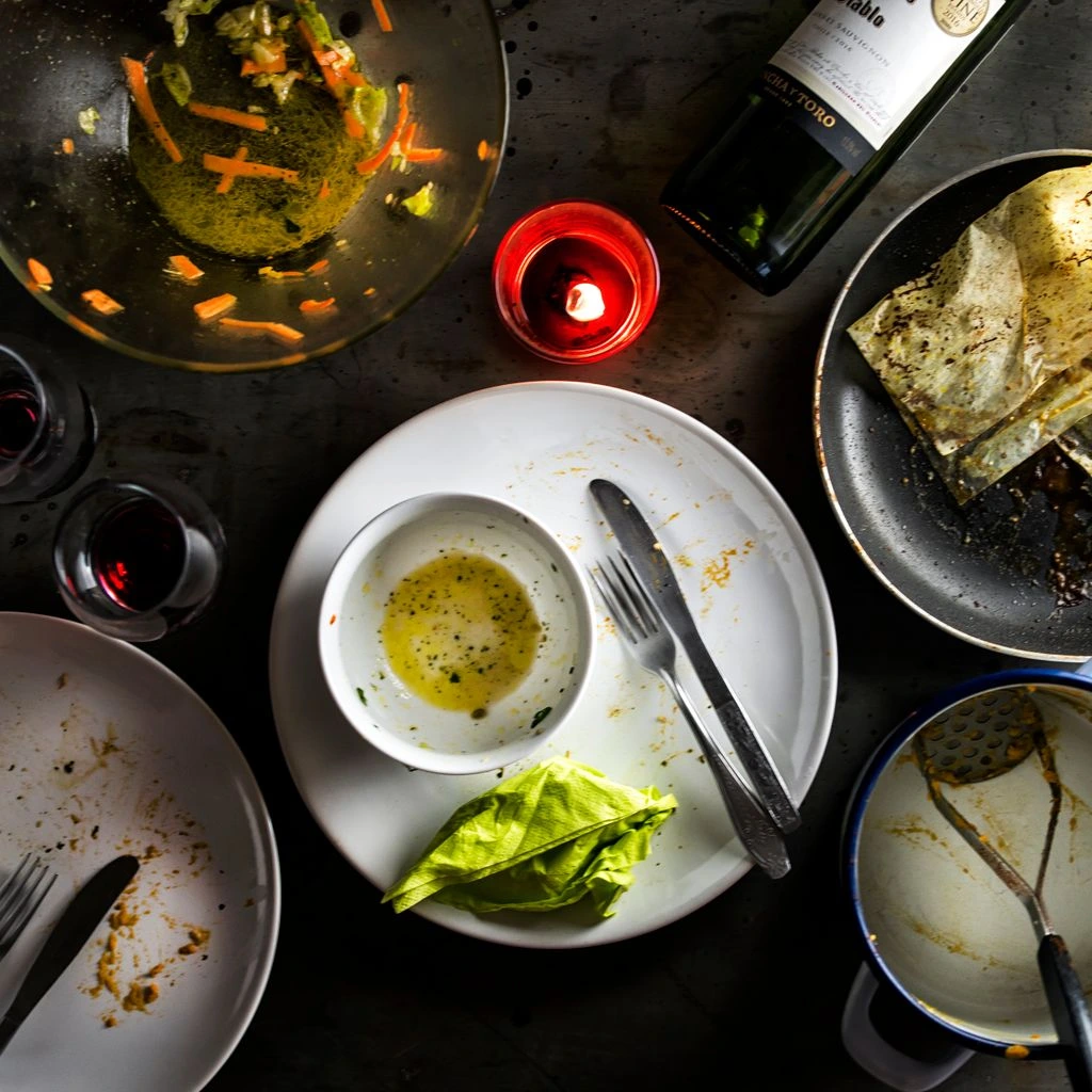 An overhead view of a table set for four on a Tuesday.